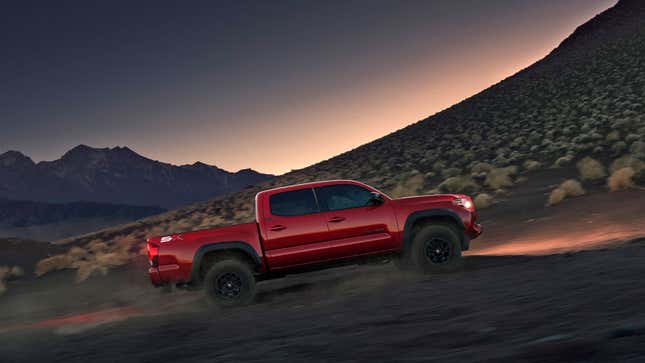 A photo of a red Toyota Tacoma pickup truck. 